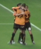 Carl Cort celebrates his second goal with Kenny and Sparky